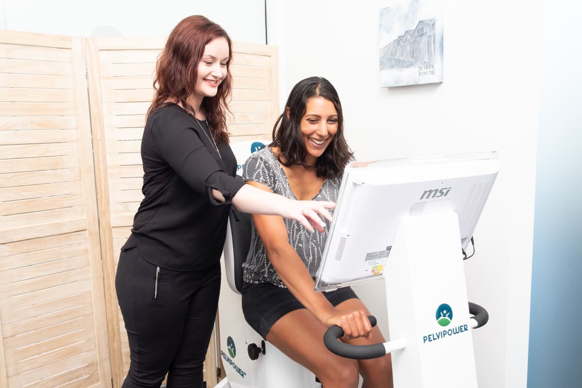 A PelviPower session at the CoreGood clinic, seated and fully clothed, with a clinician alongside